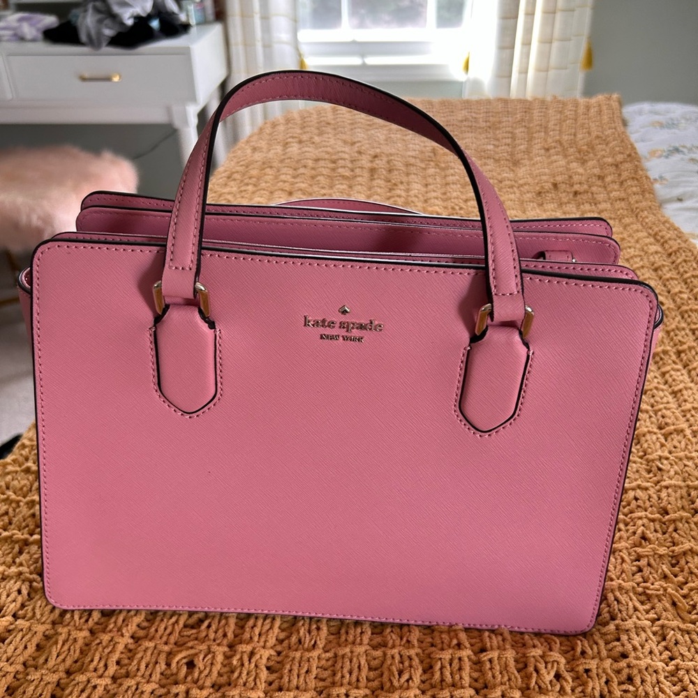 Kate Spade pink purse. Gently used. Has a removable crossbody strap.